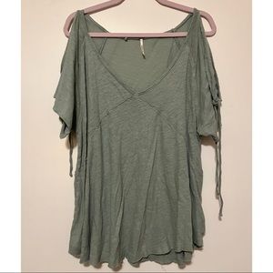 Green Free People babydoll top with cold shoulder that ties.